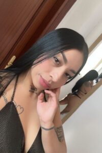 black hair callgirl with tattoos